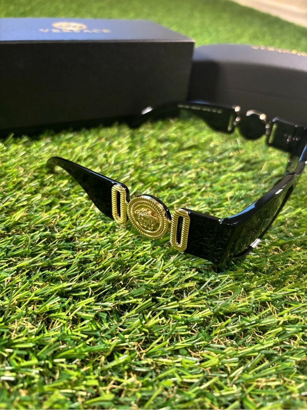 Versace Men’s Black Glossy Sunglasses with Gold Logo Accents
